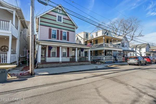 a view of a building with car parked