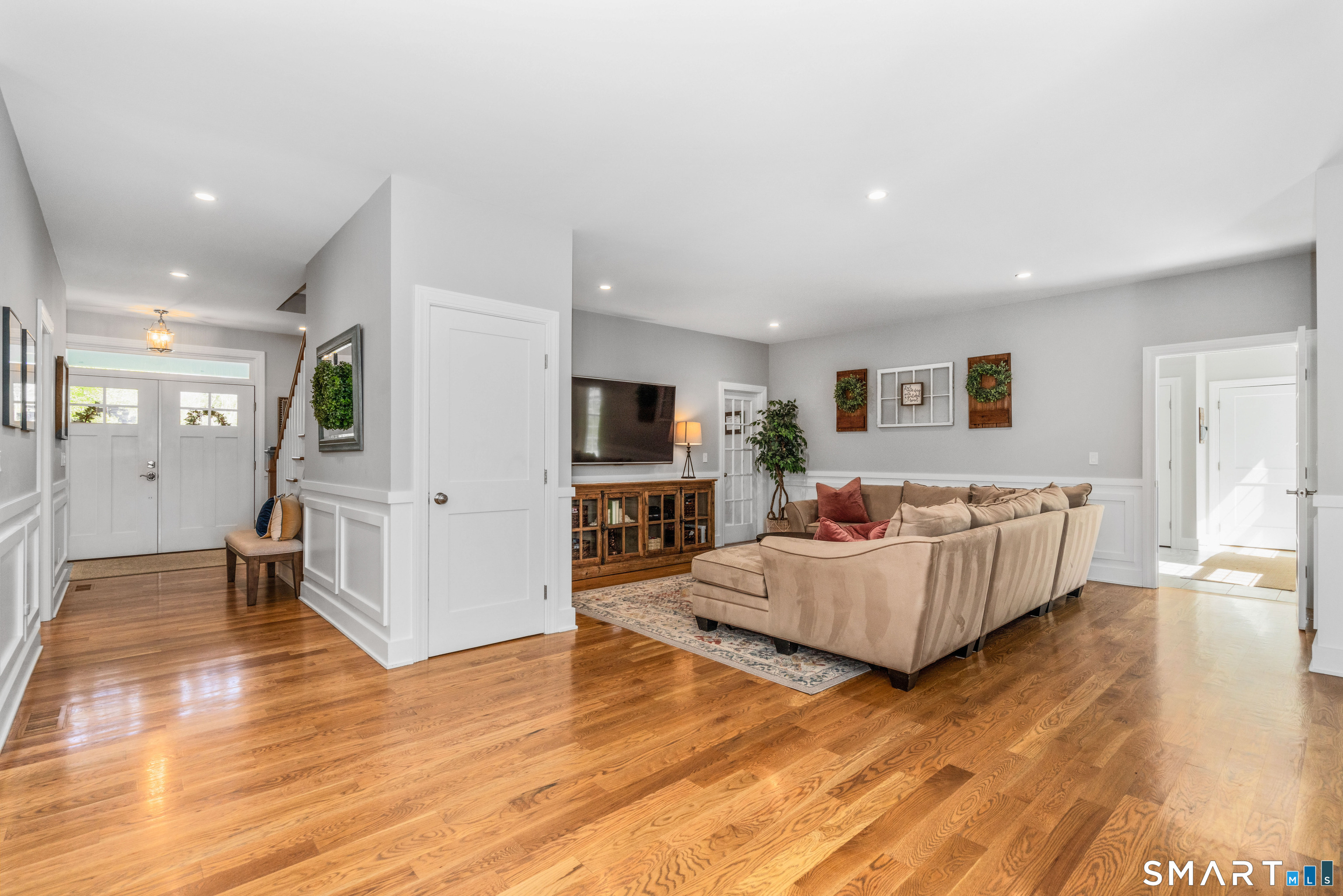152 Old Farms Road Simsbury, CT 06070 - Photo 12 of 40 A spacious living room is located off the kitchen with access to the study and mudroom