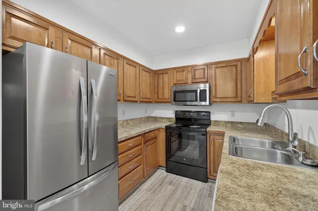 a view of an empty room and wooden floor