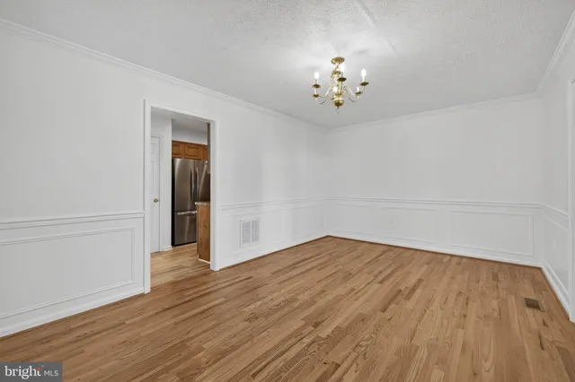 a kitchen with granite countertop a sink and cabinets