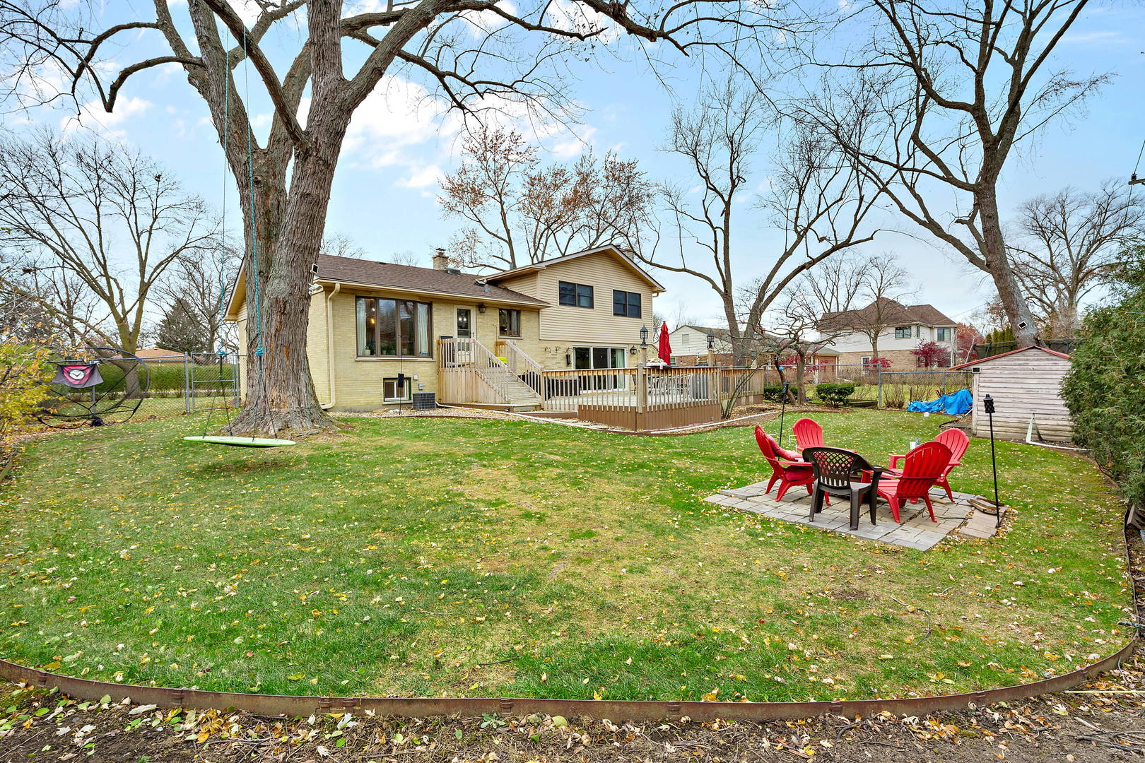 1527 Sunset Ridge Road Glenview, IL 60025 - Photo 19 of 20 a front view of a house with garden and trees