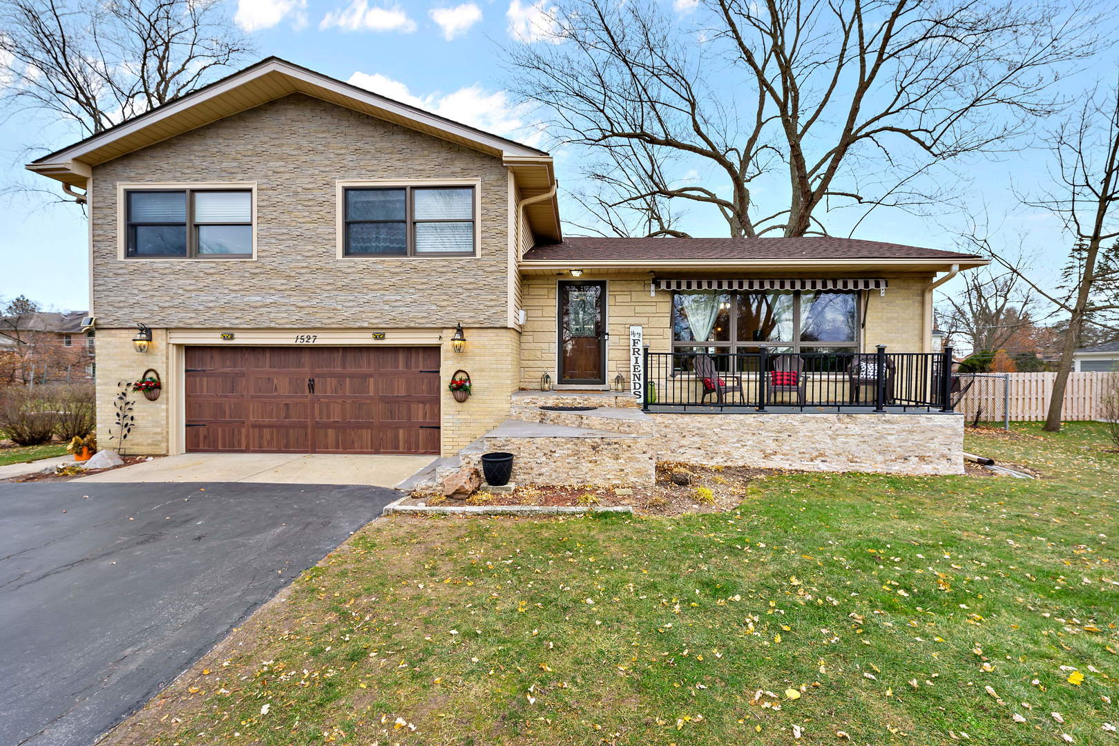 1527 Sunset Ridge Road Glenview, IL 60025 - Photo 20 of 20 a front view of a house with a yard and garage