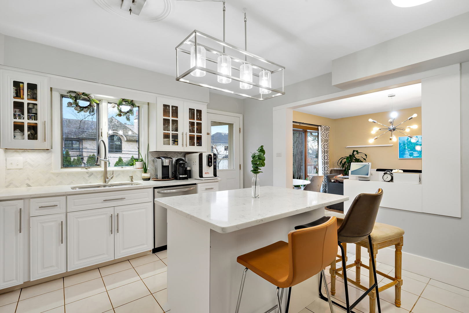 1527 Sunset Ridge Road Glenview, IL 60025 - Photo 4 of 20 a large kitchen with a table and chairs