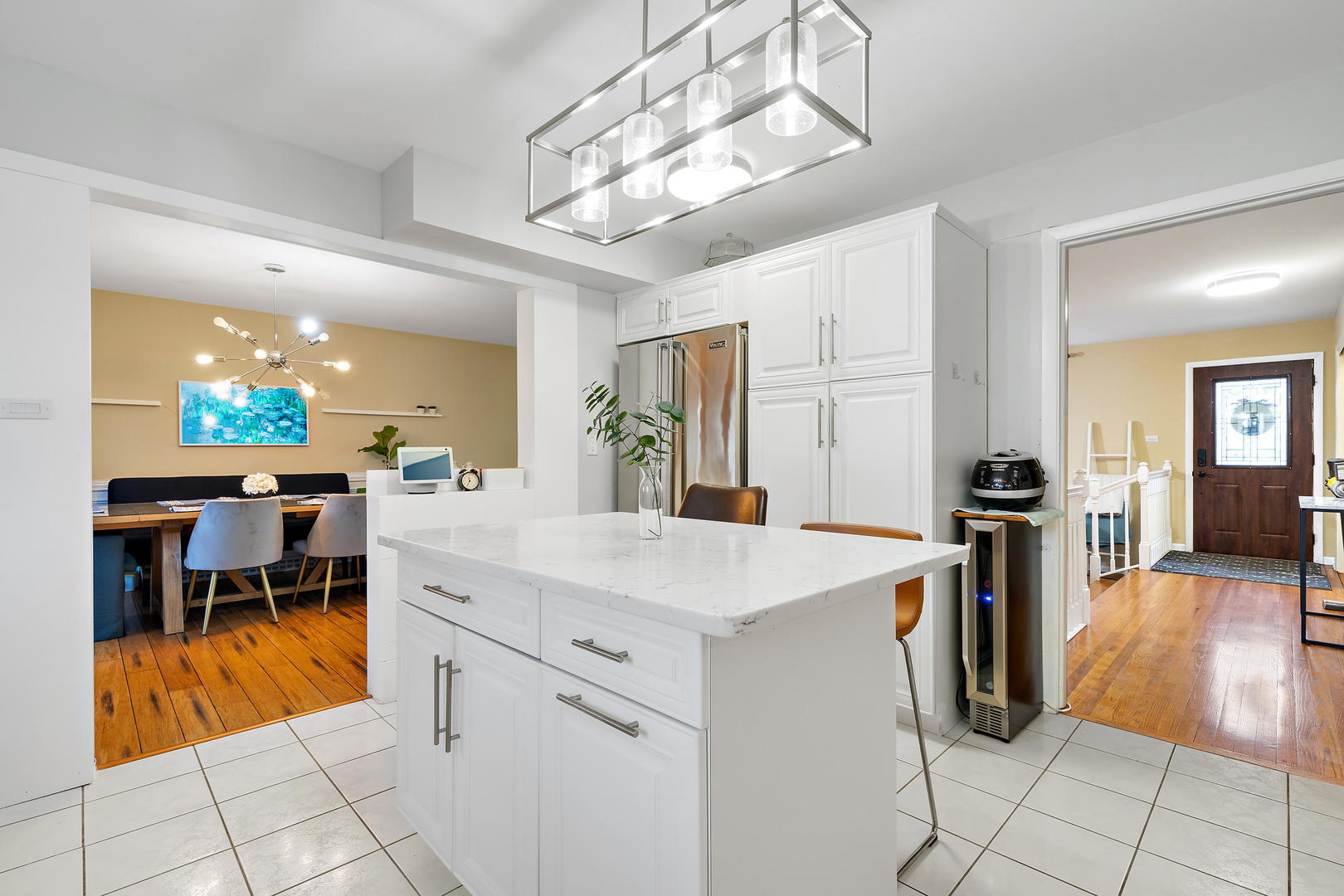 1527 Sunset Ridge Road Glenview, IL 60025 - Photo 6 of 20 a kitchen with a sink a stove and chairs