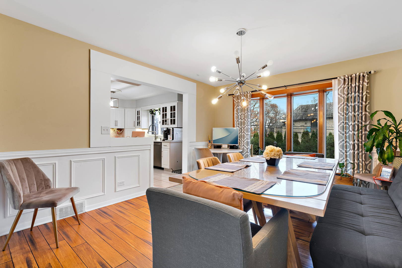 1527 Sunset Ridge Road Glenview, IL 60025 - Photo 7 of 20 a view of a dining room with furniture wooden floor and chandelier