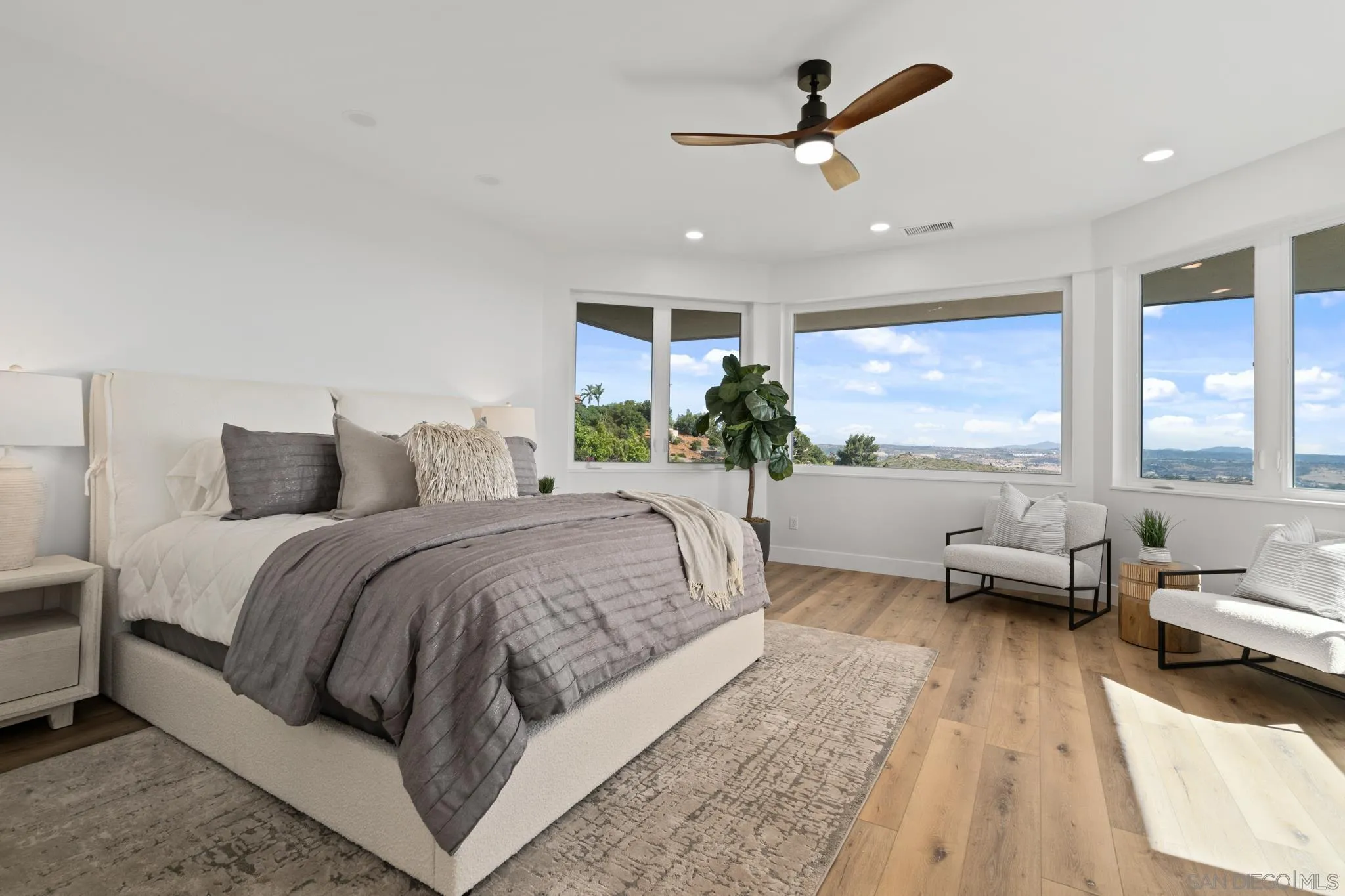 15486 Markar Road Poway, CA 92064 - Photo 19 of 63 a spacious bedroom with a large bed and a large window