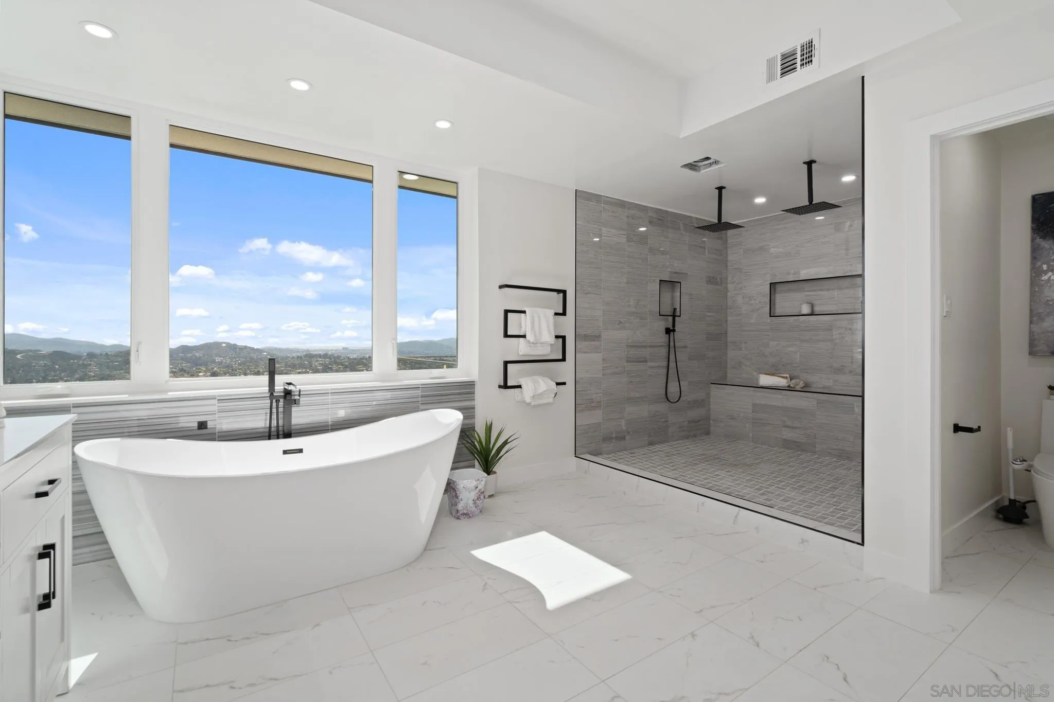15486 Markar Road Poway, CA 92064 - Photo 21 of 63 a bathroom with a bathtub and a shower