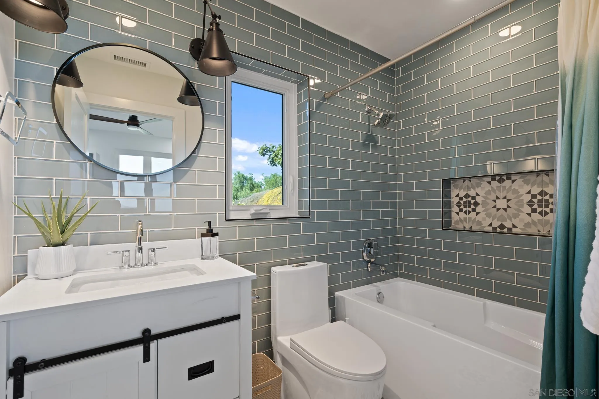15486 Markar Road Poway, CA 92064 - Photo 27 of 63 a bathroom with a sink mirror toilet and bathtub