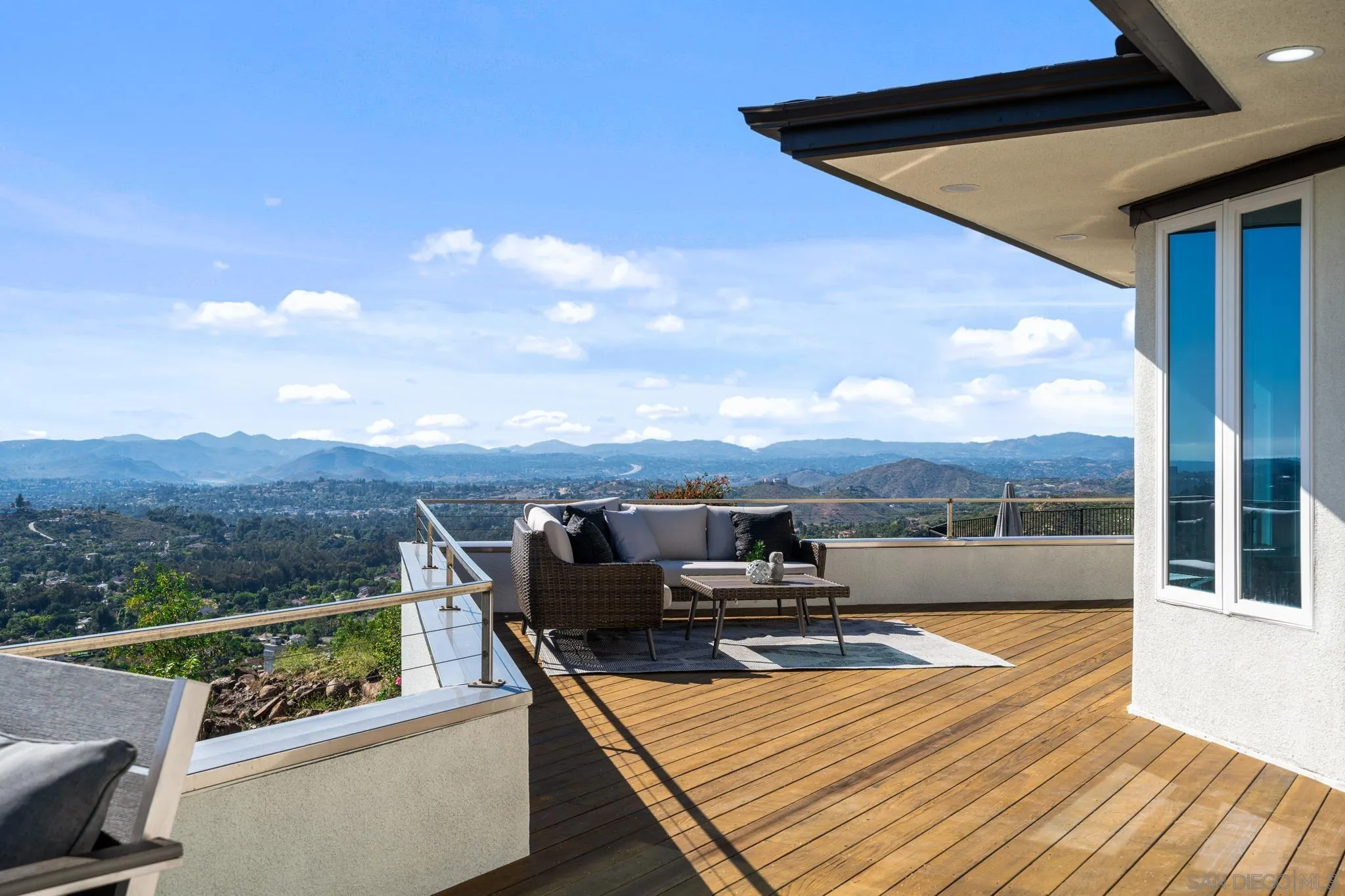 15486 Markar Road Poway, CA 92064 - Photo 29 of 63 a view of roof deck with two couches and wooden floor