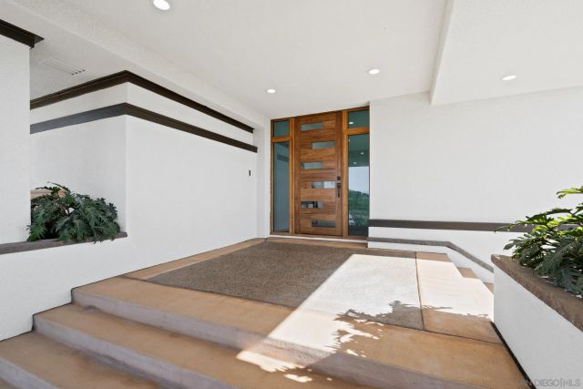 a living room with furniture wooden floor and a fireplace