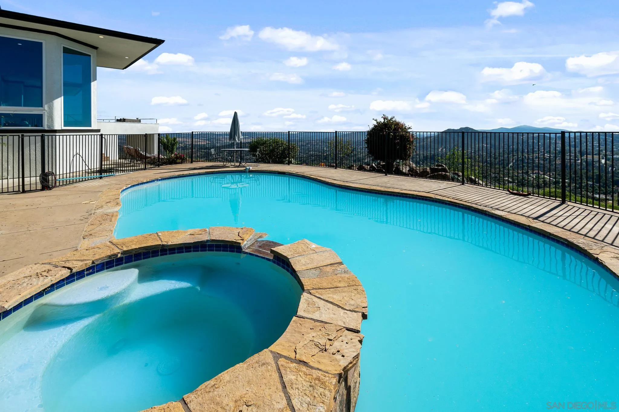 15486 Markar Road Poway, CA 92064 - Photo 32 of 63 a view of a swimming pool with a yard