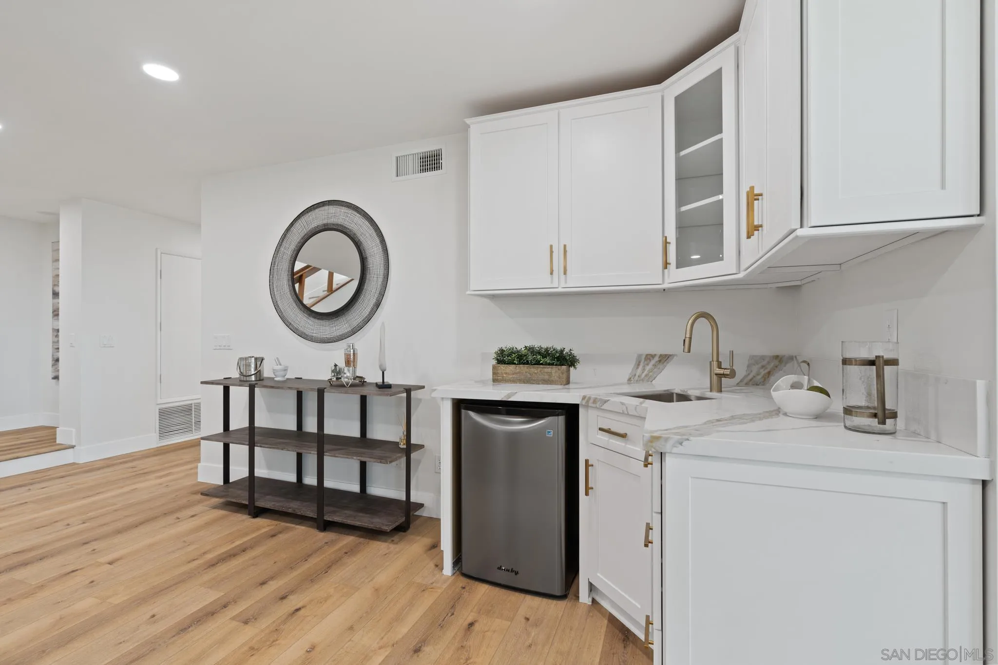 15486 Markar Road Poway, CA 92064 - Photo 34 of 63 a kitchen with a cabinets and wooden floor
