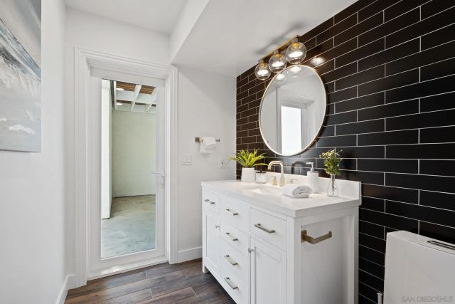 a view of a lake with houses in the back