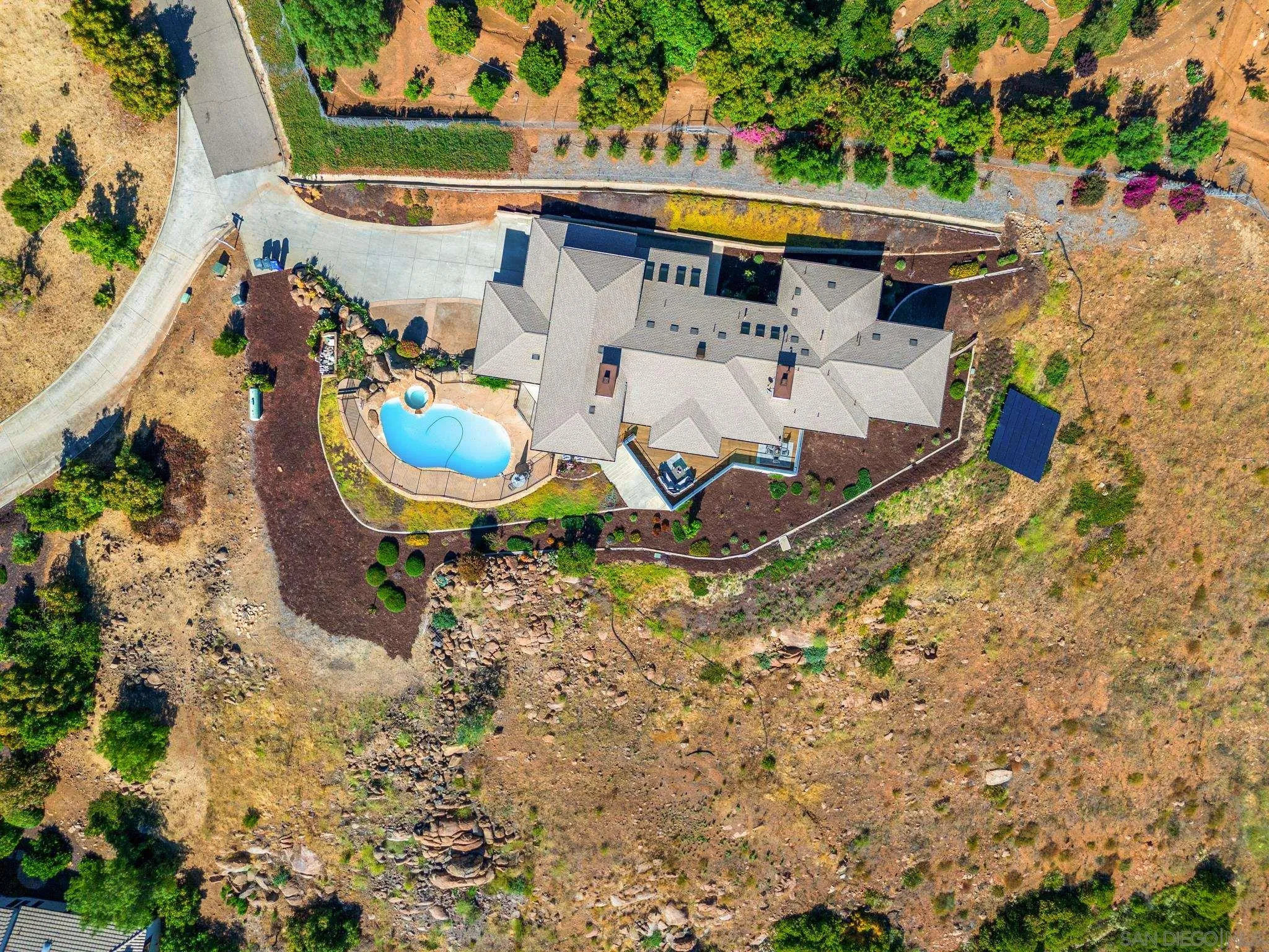 15486 Markar Road Poway, CA 92064 - Photo 47 of 63 an aerial view of a house with a yard and sitting area