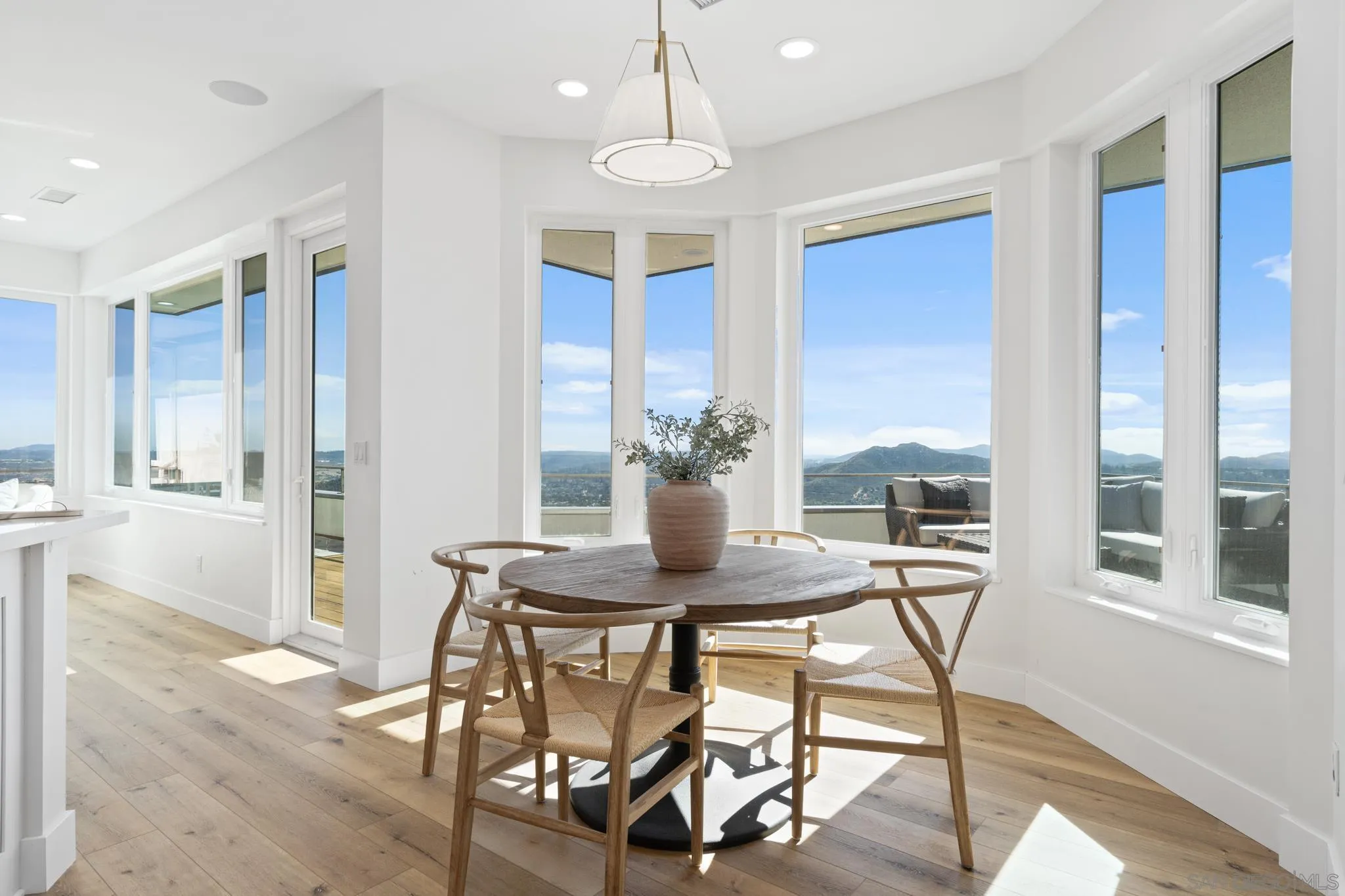 15486 Markar Road Poway, CA 92064 - Photo 8 of 63 a view of a dining room with furniture window and wooden floor