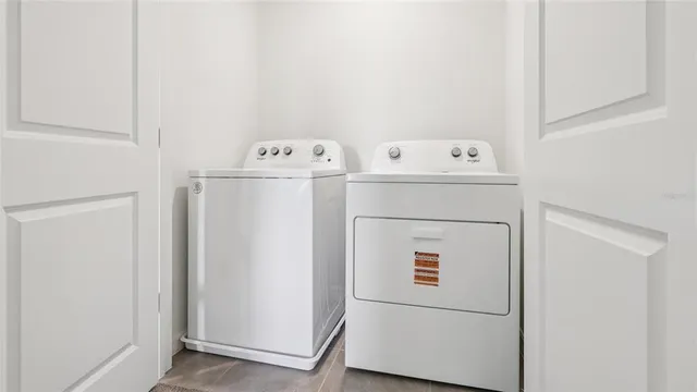 a utility room with dryer and washer