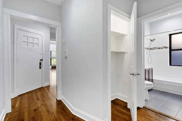 a view of a bathroom with a tub and shower