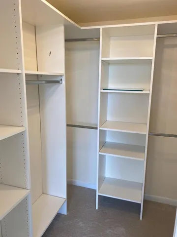 a view of an empty walk in closet