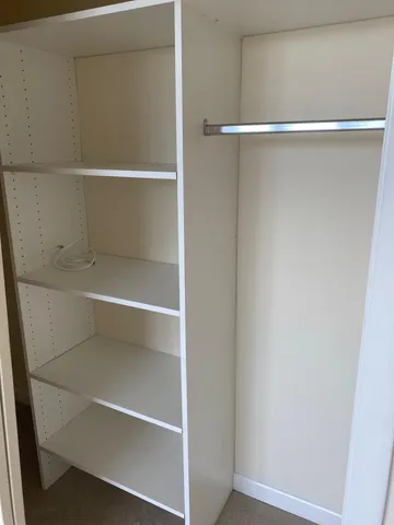 a view of an empty walk in closet