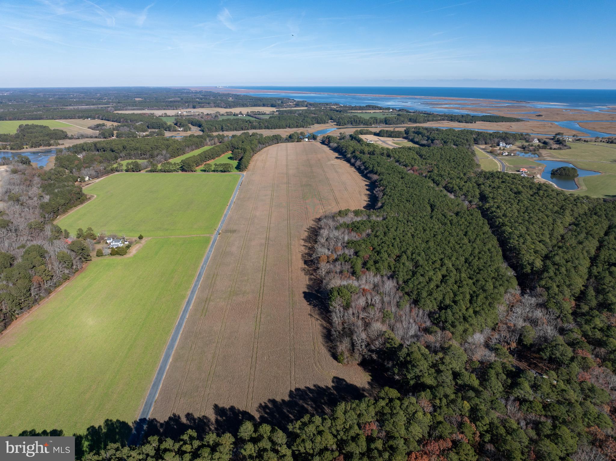 Folly Creek Road Accomac, VA 23301 - Photo 9 of 15 an aerial view of a golf course with a lake view