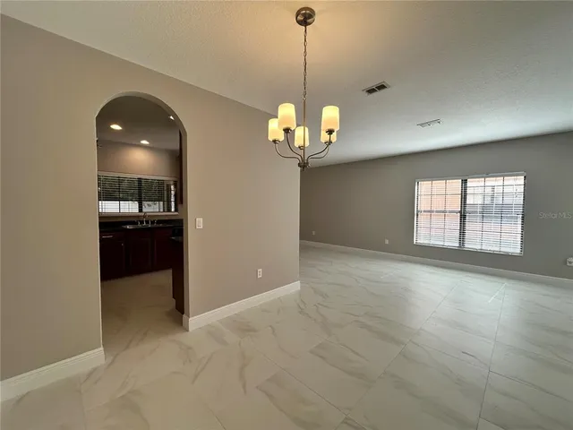 a view of a room with a chandelier