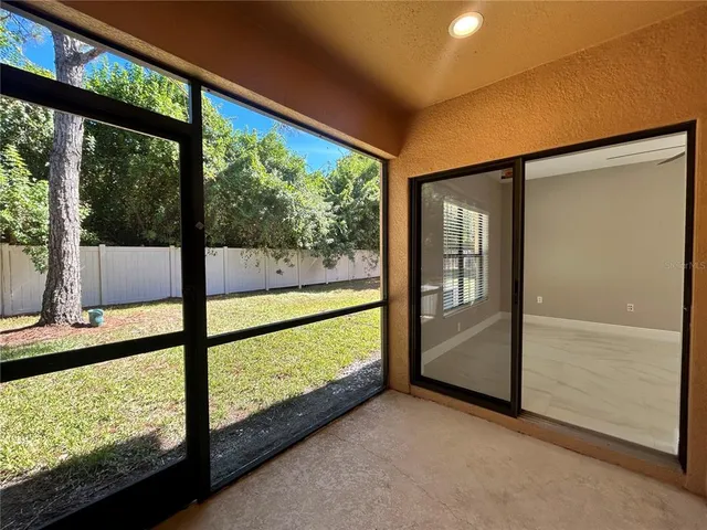 a view of a tree in front of a yard