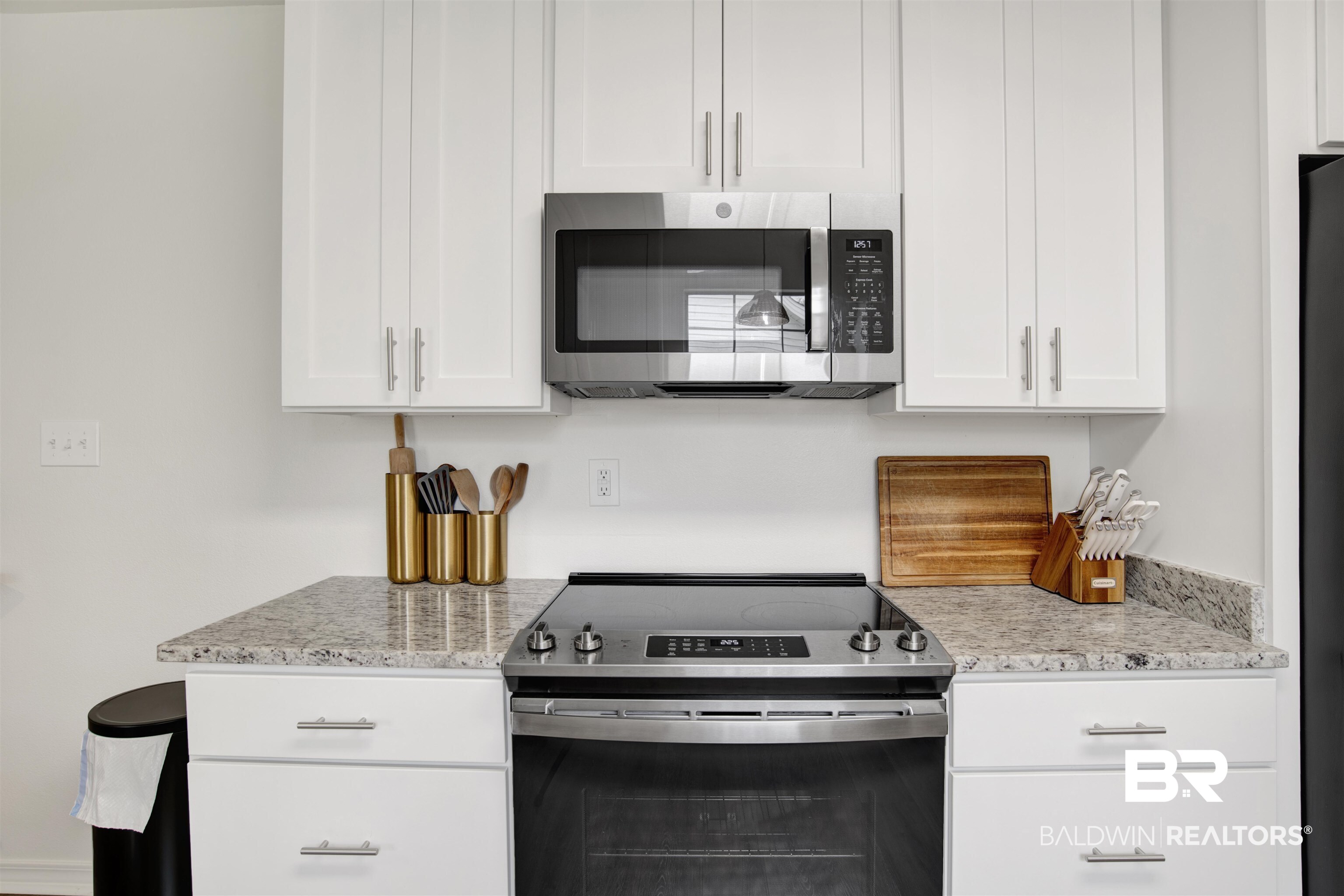 4012 Kendallbrook Loop Foley, AL 36535 - Photo 12 of 31 Kitchen with appliances with stainless steel finishes, white cabinetry, and light stone countertops