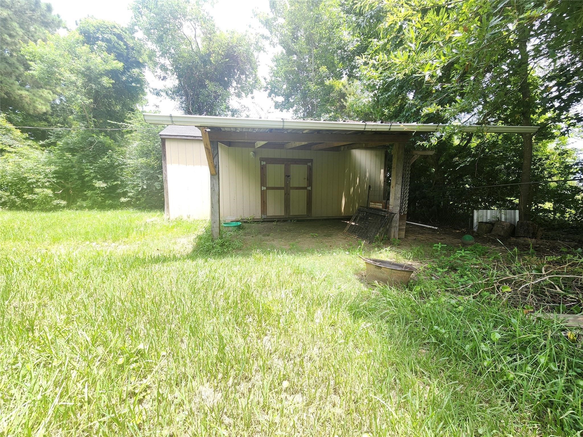 1325 Robinson Road Silsbee, TX 77656 - Photo 2 of 10 a view of a house with backyard and garden