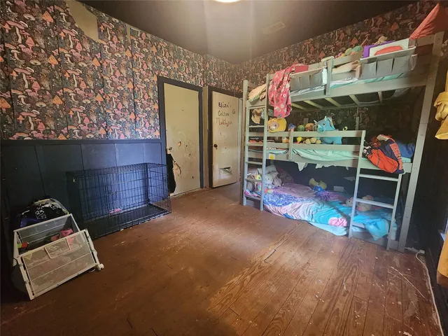 a large kitchen with a stove a sink and a refrigerator