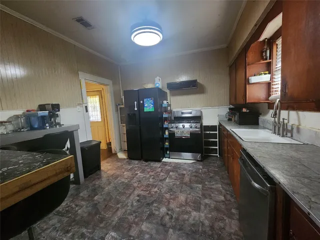 a room with a couch and a view of living room