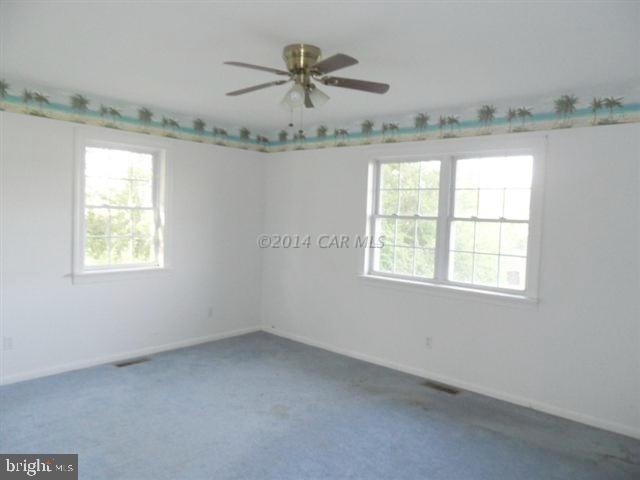 3388 Whitehaven Road Tyaskin, MD 21865 - Photo 11 of 13 an empty room with a ceiling fan and window