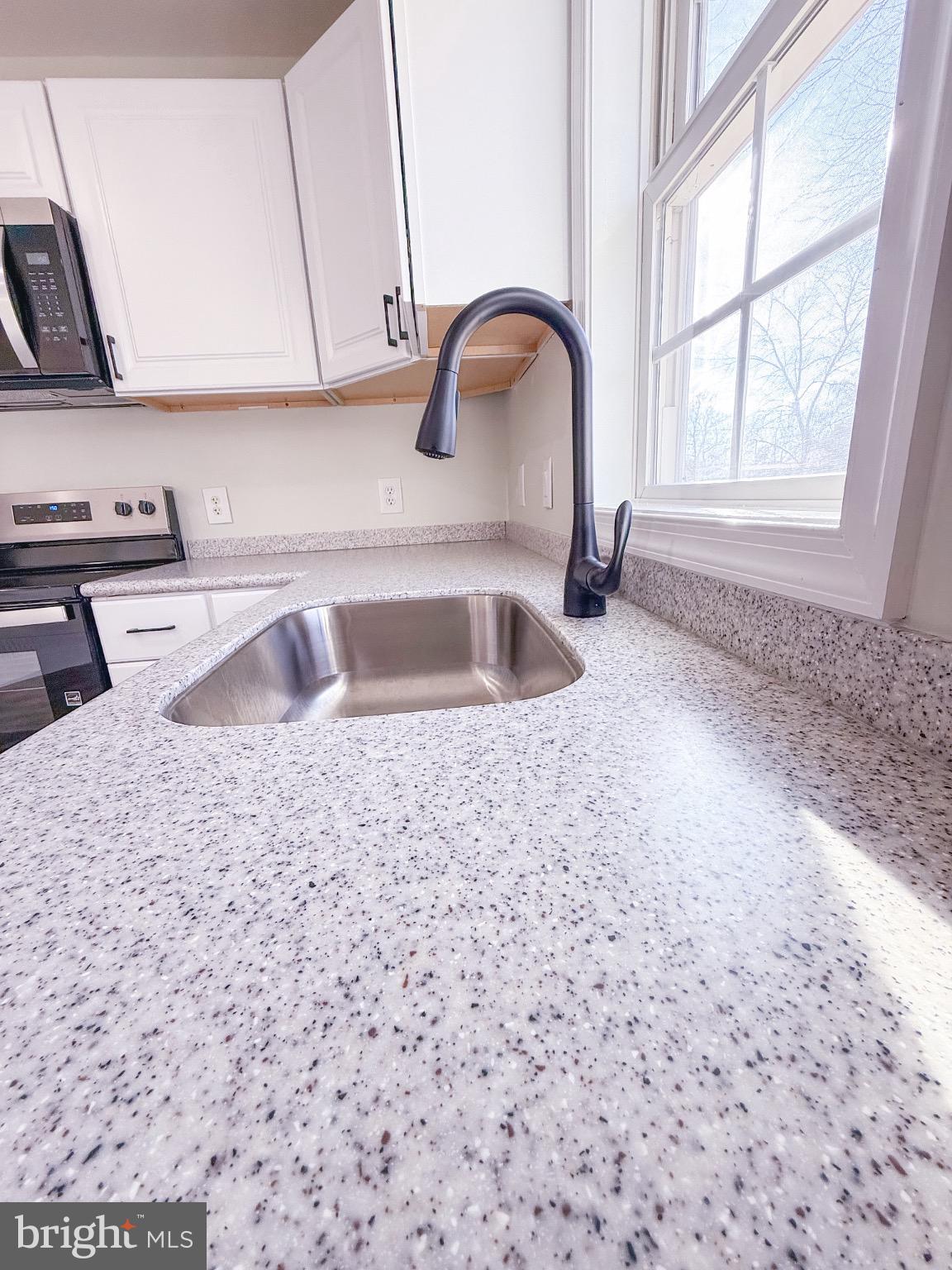 18558 Oak Road Bridgeville, DE 19933 - Photo 24 of 36 Modern kitchen with sleek countertops.