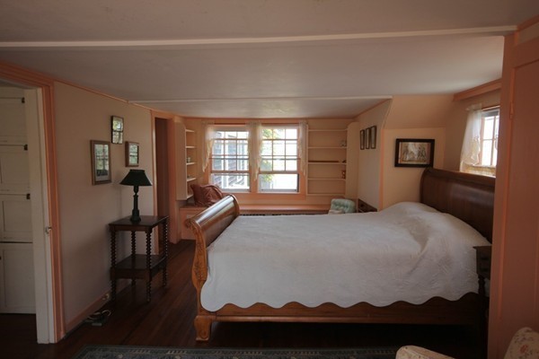 2034 Main Road Westport, MA 02791 - Photo 16 of 28 a bedroom with a bed and wooden floor