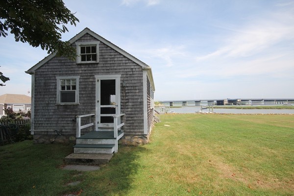 2034 Main Road Westport, MA 02791 - Photo 5 of 28 a front view of a house with a yard