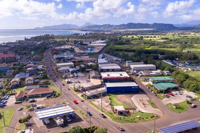 an aerial view of residential houses and outdoor space