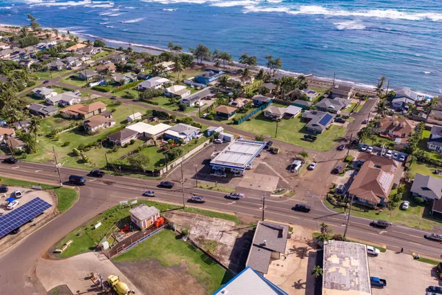 an aerial view of a house with a yard