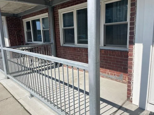 a view of a balcony with door
