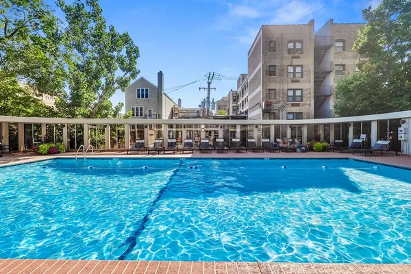 a view of house with swimming pool