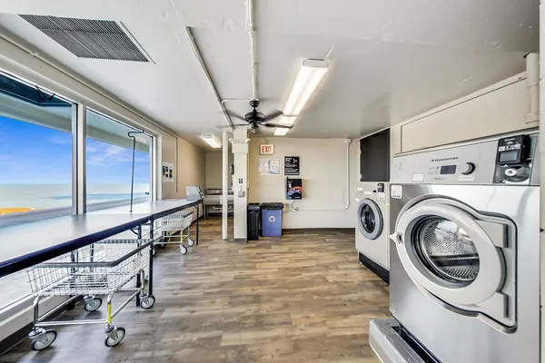 a view of a hallway with washer and dryer