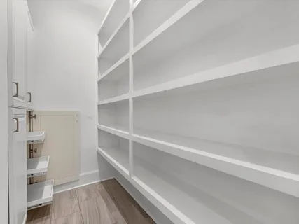 a view of an empty walk in closet