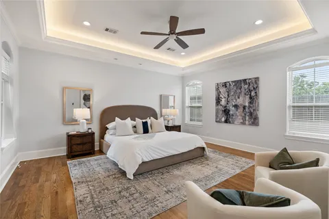 a bedroom with a bed and a couch