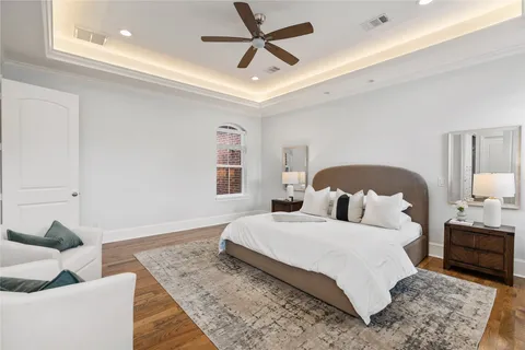 a bedroom with a bed and a couch