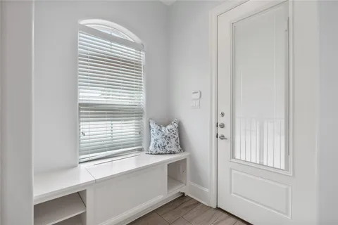 a bathroom with a bathtub and a window
