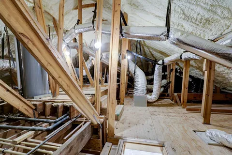 a view of an empty room with stairs
