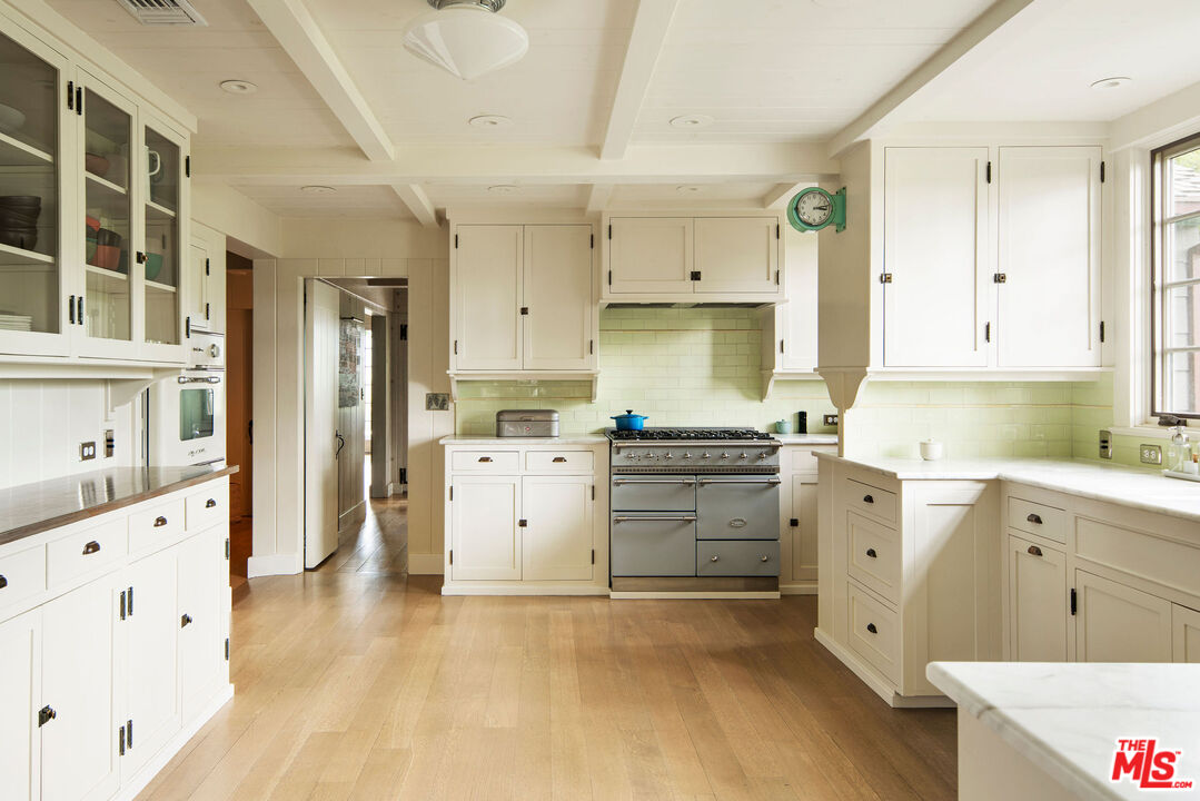 San Antonio Street Ojai, CA 93023 - Photo 16 of 73 a kitchen with cabinets appliances and a wooden floor