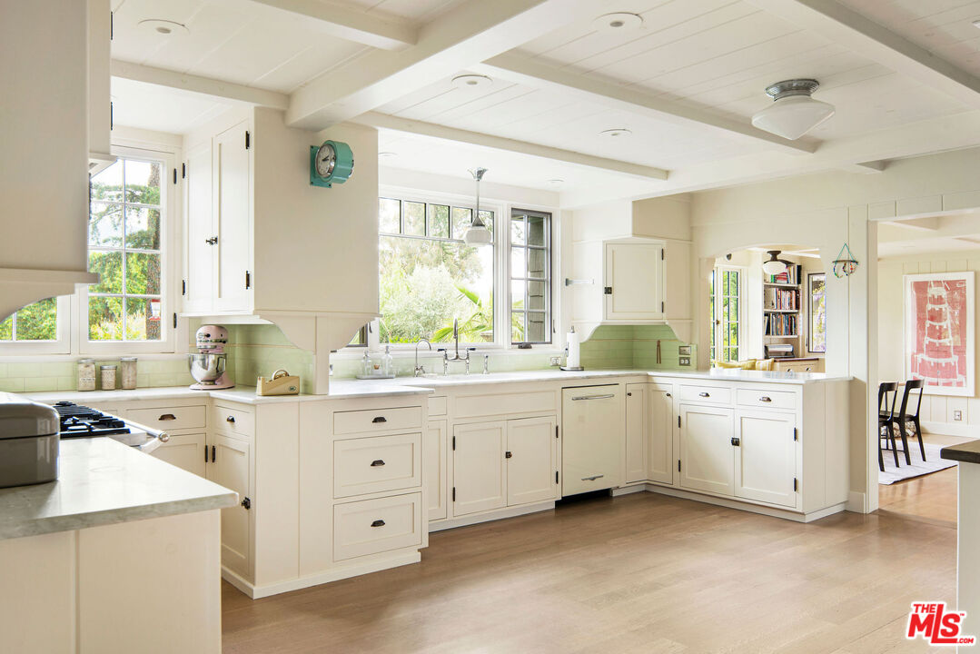 San Antonio Street Ojai, CA 93023 - Photo 17 of 73 a large white bathroom with a double vanity sink a mirror and a bathtub