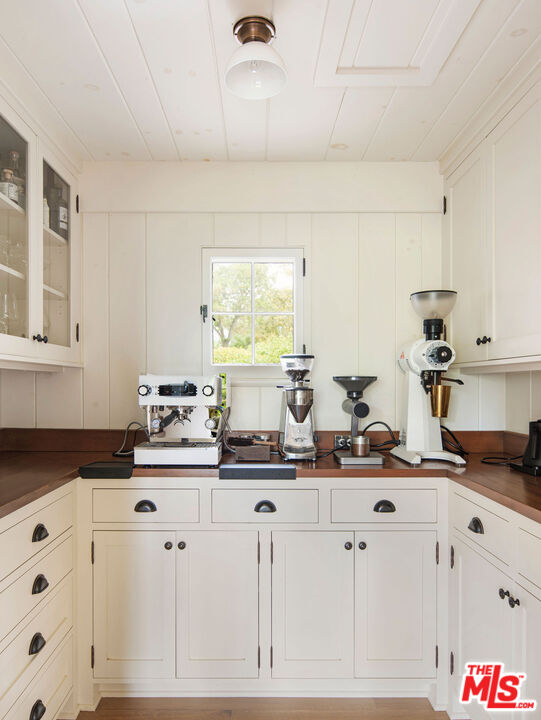 San Antonio Street Ojai, CA 93023 - Photo 20 of 73 a kitchen with appliances a sink a window and white cabinets