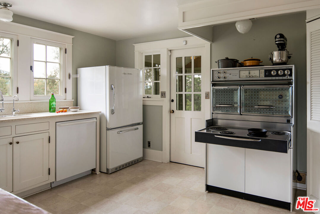San Antonio Street Ojai, CA 93023 - Photo 47 of 73 a kitchen with a refrigerator and cabinets