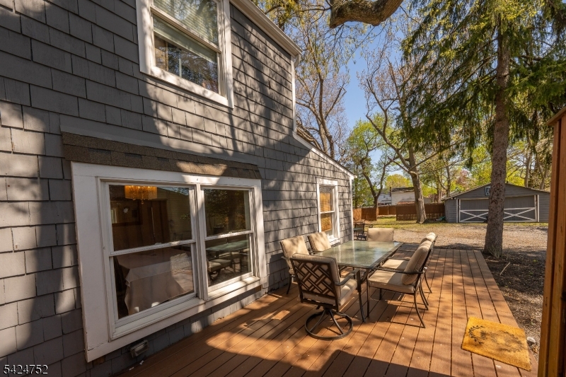 1401 Mt Holly Road Burlington, NJ 08016 - Photo 15 of 23 a view of a patio with table and chairs and wooden floor
