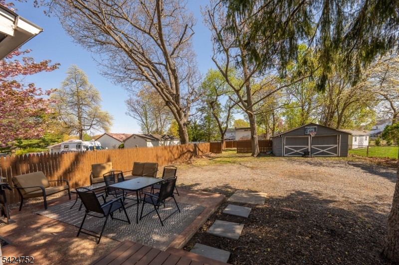 1401 Mt Holly Road Burlington, NJ 08016 - Photo 17 of 23 a view of a backyard with table and chairs and a fire pit